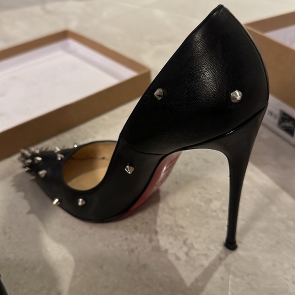 Christian Louboutin Shoes - CHRISTIAN Louboutin black heels with silver spikes incl extra heel caps and box.